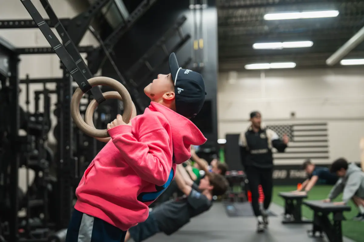 Young player training on gymnastic rings at GMT